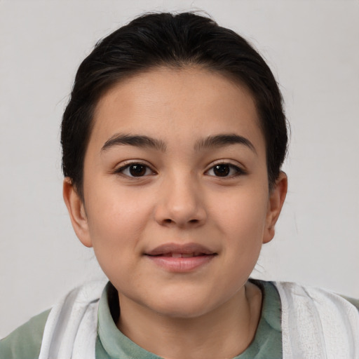 Joyful white child female with short  brown hair and brown eyes