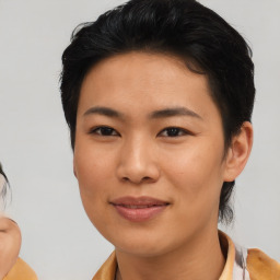 Joyful asian young-adult female with medium  black hair and brown eyes