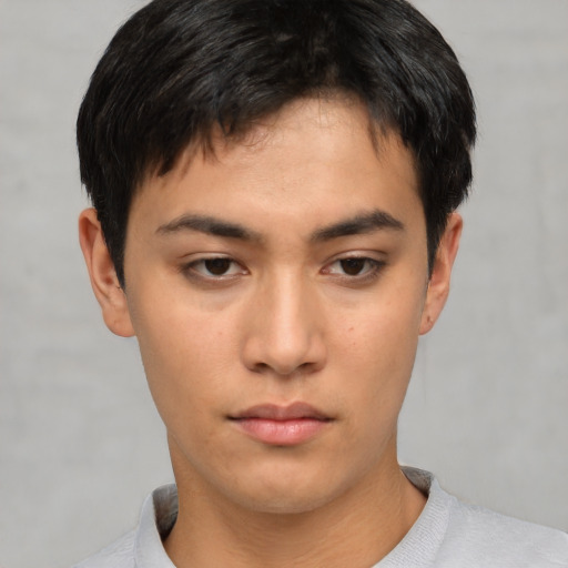 Neutral asian young-adult male with short  brown hair and brown eyes