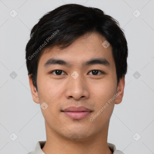 Joyful asian young-adult male with short  black hair and brown eyes