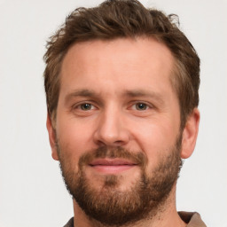 Joyful white adult male with short  brown hair and brown eyes