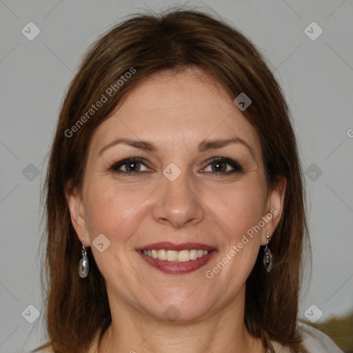 Joyful white adult female with medium  brown hair and grey eyes