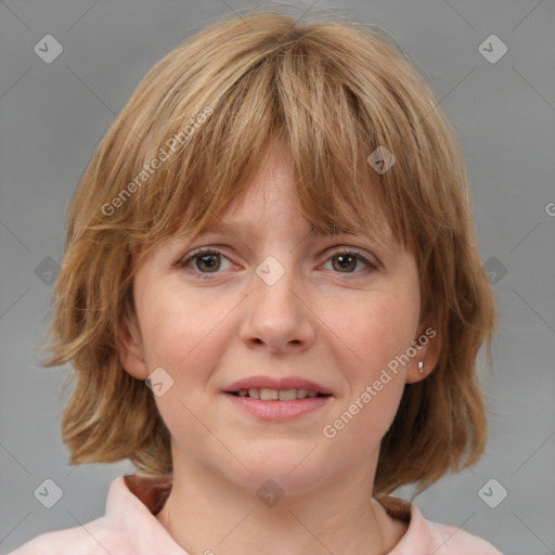 Joyful white young-adult female with medium  brown hair and blue eyes