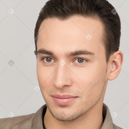 Joyful white young-adult male with short  brown hair and brown eyes