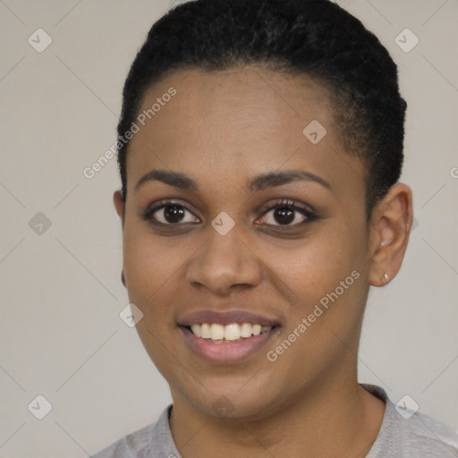 Joyful black young-adult female with short  black hair and brown eyes