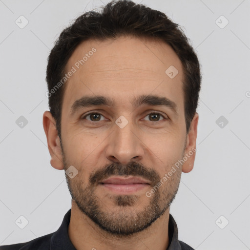 Joyful white young-adult male with short  black hair and brown eyes