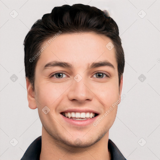 Joyful white young-adult male with short  black hair and brown eyes