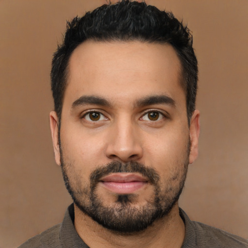 Neutral latino young-adult male with short  black hair and brown eyes