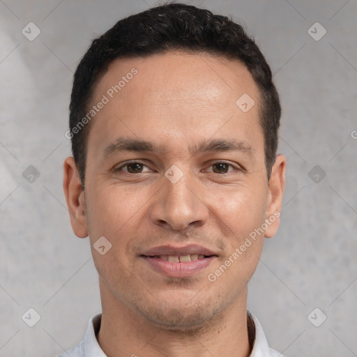 Joyful white young-adult male with short  black hair and brown eyes