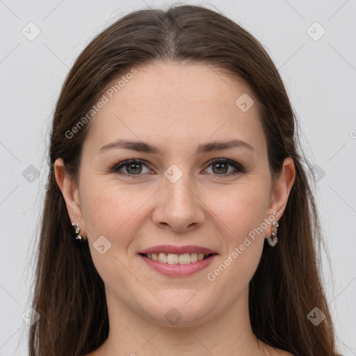 Joyful white young-adult female with long  brown hair and grey eyes