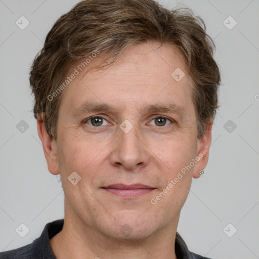 Joyful white adult male with short  brown hair and grey eyes