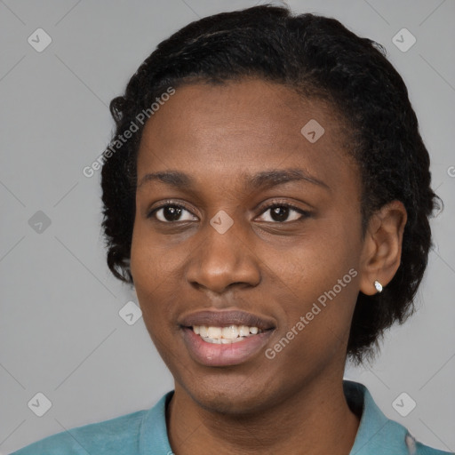 Joyful black young-adult female with short  black hair and brown eyes