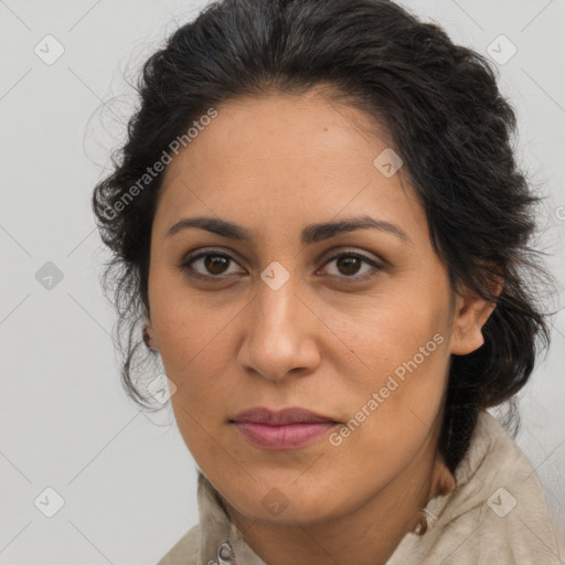 Joyful latino adult female with medium  brown hair and brown eyes