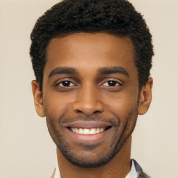 Joyful black young-adult male with short  black hair and brown eyes