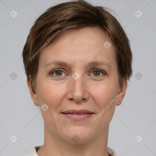 Joyful white adult female with short  brown hair and grey eyes