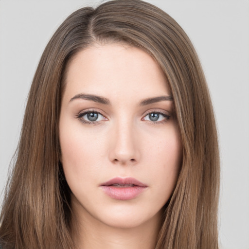 Neutral white young-adult female with long  brown hair and brown eyes