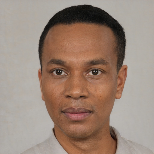 Neutral black adult male with short  black hair and brown eyes