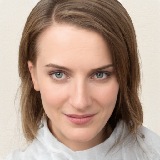 Joyful white young-adult female with medium  brown hair and blue eyes