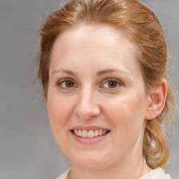 Joyful white young-adult female with medium  brown hair and blue eyes