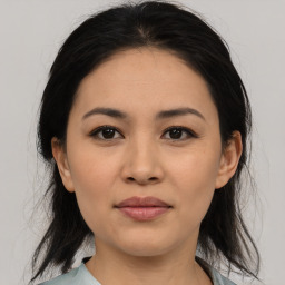 Joyful asian young-adult female with medium  brown hair and brown eyes