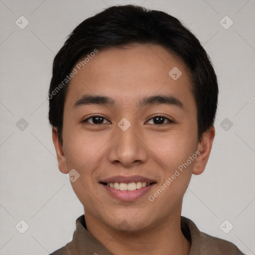 Joyful asian young-adult male with short  black hair and brown eyes