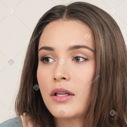 Neutral white young-adult female with long  brown hair and brown eyes