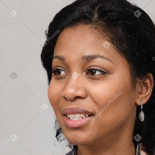 Joyful black young-adult female with medium  black hair and brown eyes