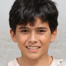 Joyful white child male with short  brown hair and brown eyes