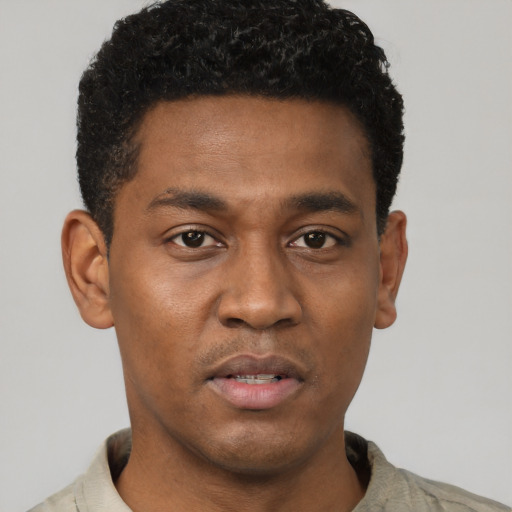 Neutral latino young-adult male with short  brown hair and brown eyes
