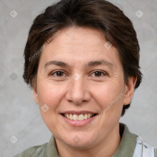 Joyful white adult female with short  brown hair and brown eyes