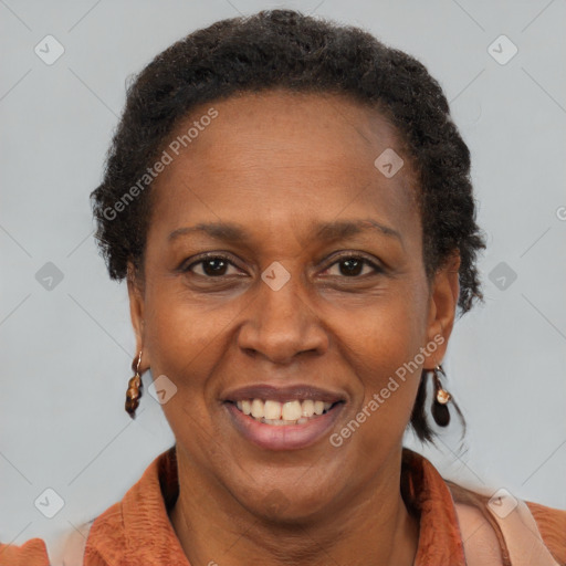 Joyful black adult female with short  brown hair and brown eyes