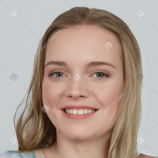 Joyful white young-adult female with medium  brown hair and blue eyes