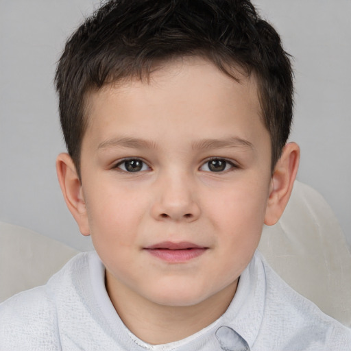 Joyful white child male with short  brown hair and brown eyes