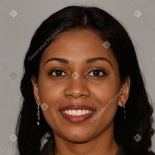 Joyful black young-adult female with long  brown hair and brown eyes