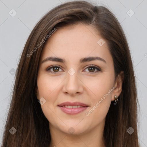 Joyful white young-adult female with long  brown hair and brown eyes