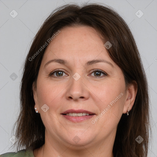 Joyful white adult female with medium  brown hair and brown eyes