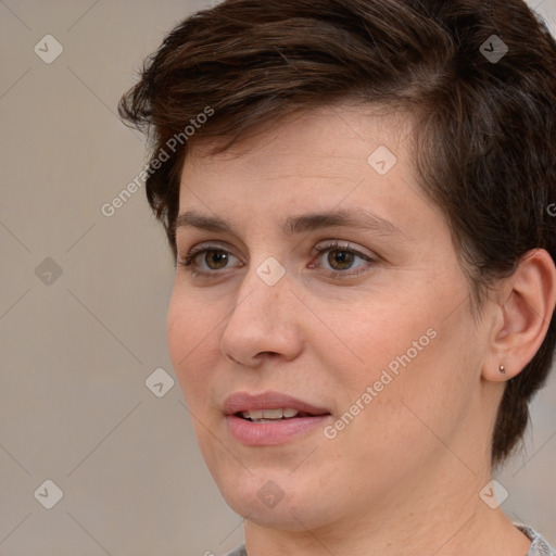 Joyful white adult female with medium  brown hair and brown eyes