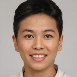 Joyful asian young-adult male with short  brown hair and brown eyes