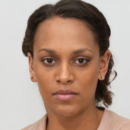 Neutral black young-adult female with long  brown hair and brown eyes