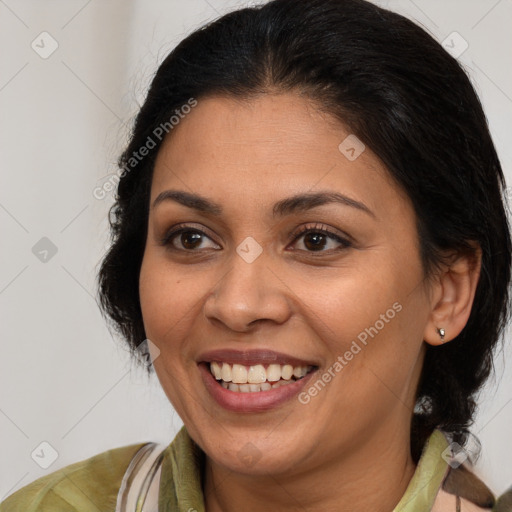 Joyful latino young-adult female with medium  brown hair and brown eyes