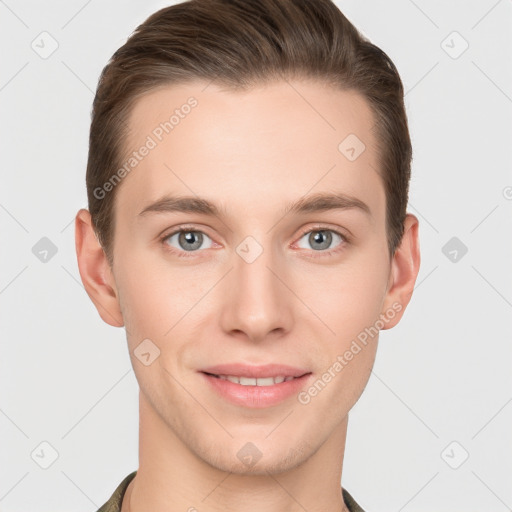 Joyful white young-adult male with short  brown hair and grey eyes