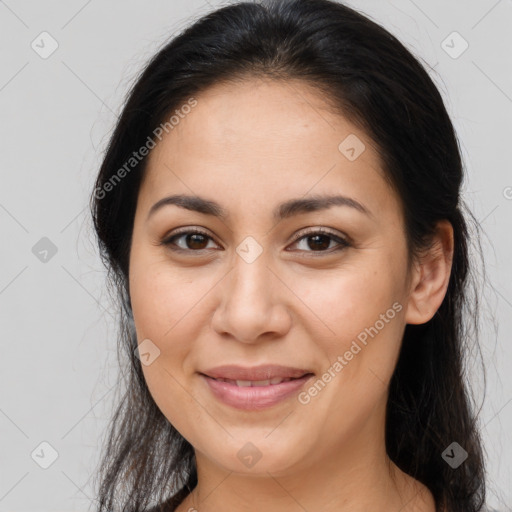 Joyful latino young-adult female with long  brown hair and brown eyes