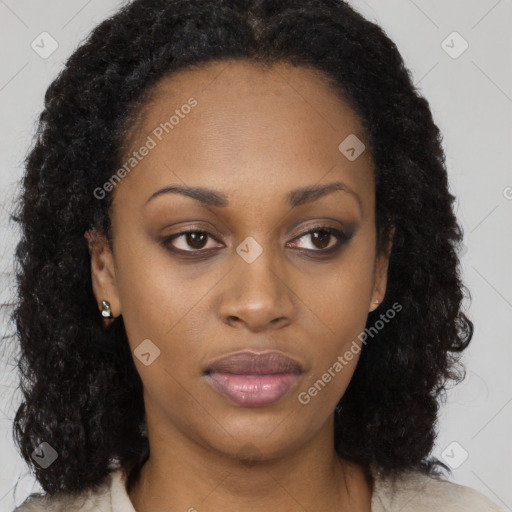 Neutral black young-adult female with long  brown hair and brown eyes