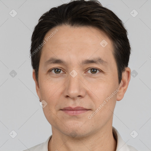 Joyful white adult male with short  brown hair and brown eyes