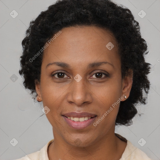 Joyful black adult female with short  brown hair and brown eyes