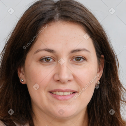 Joyful white adult female with long  brown hair and brown eyes