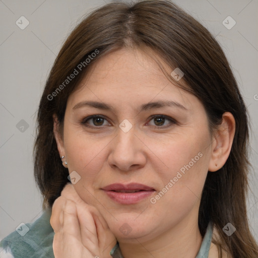 Joyful white adult female with medium  brown hair and brown eyes