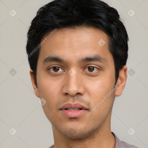 Neutral latino young-adult male with short  black hair and brown eyes