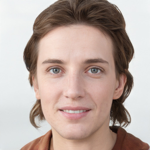 Joyful white young-adult female with medium  brown hair and grey eyes