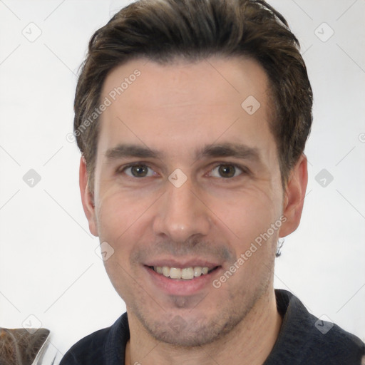 Joyful white young-adult male with short  brown hair and brown eyes